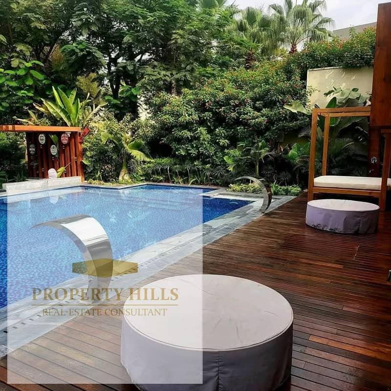 Corner Townhouse Villa with a 78-meter roof and a distinctive landscape view in October next to Al-Jazeera Club and Palm Hills
