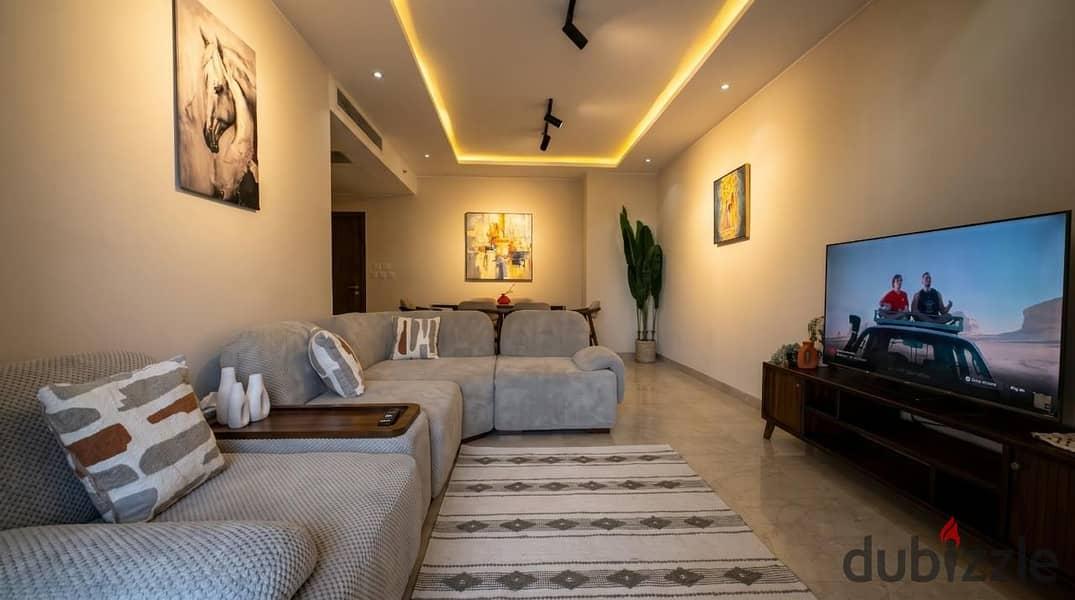 Furnished apartment for rent in Zaid Towers, Sheik Zayed, first occupancy, two bedrooms + nanny room, 3 bathrooms, seventh floor with elevator, available daily, monthly, and annually — 1/8